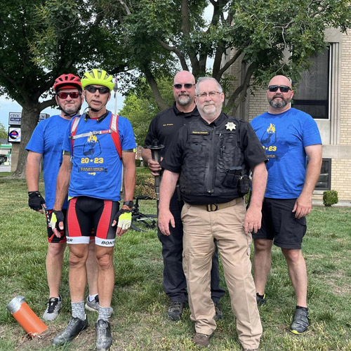 sheriff with olympic runners