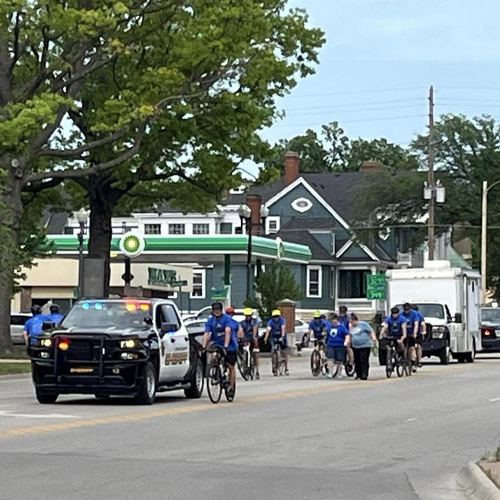 sheriff vehicle escorting runners